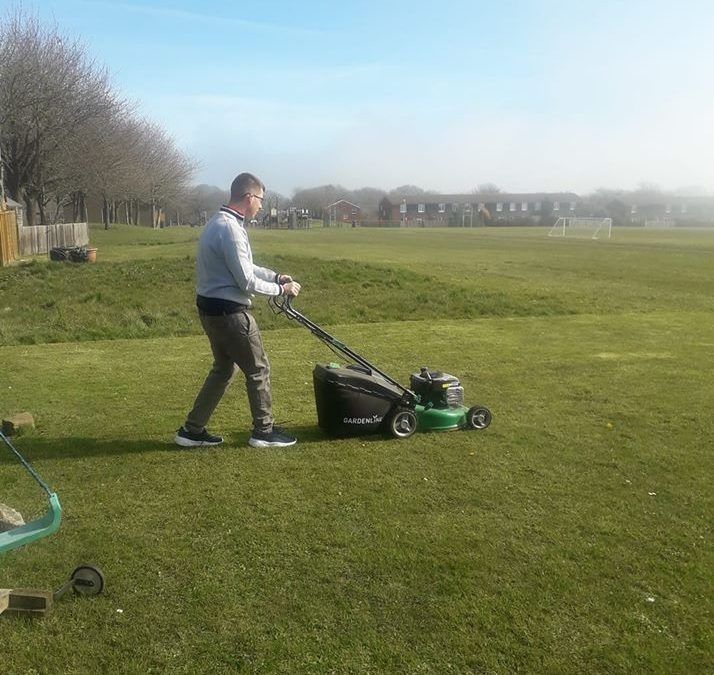 Jacob using the mower